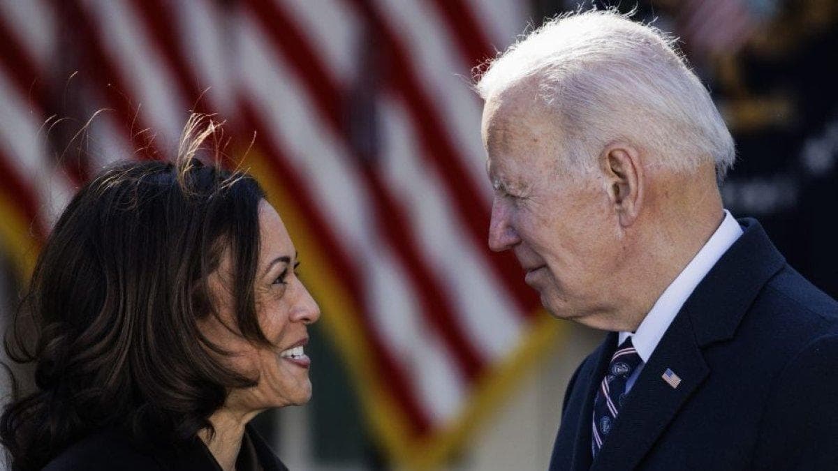 President Joe Biden exchanges words with Vice President Kamala Harris during a reception.